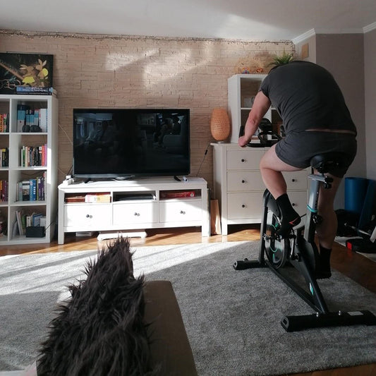 Woman enjoying a low-impact indoor cycling workout on her Wenoker Exercise bike at home