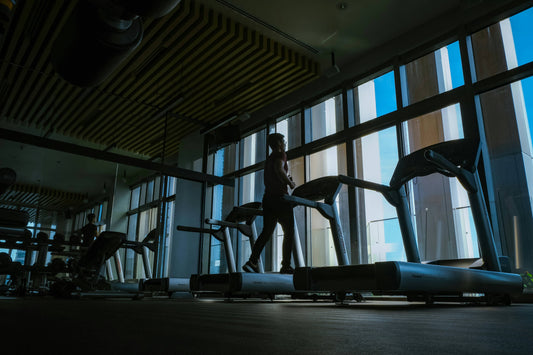 A person contemplating their cardio workout balance, illustrating the concept of finding the right amount of exercise to avoid overtraining.
