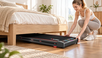 A homeowner easily guiding the slim black Wenoker T10 walking pad under a modern platform bed frame in a tidy, sunlit apartment bedroom.